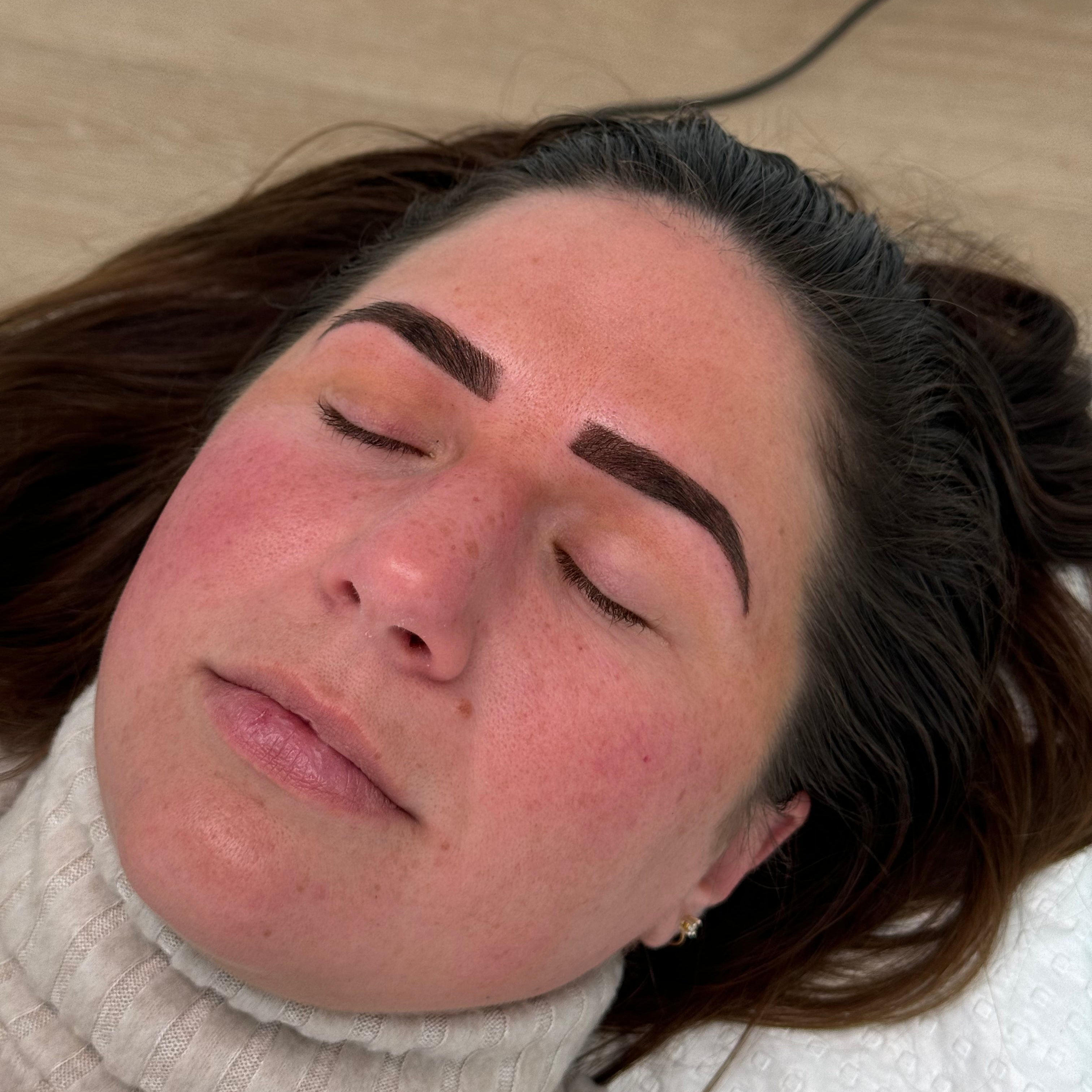 Close-up of a completed ombre brow tattooing procedure, showcasing the soft gradient effect and precision techniques taught at By Tarnee Morris in Penrith