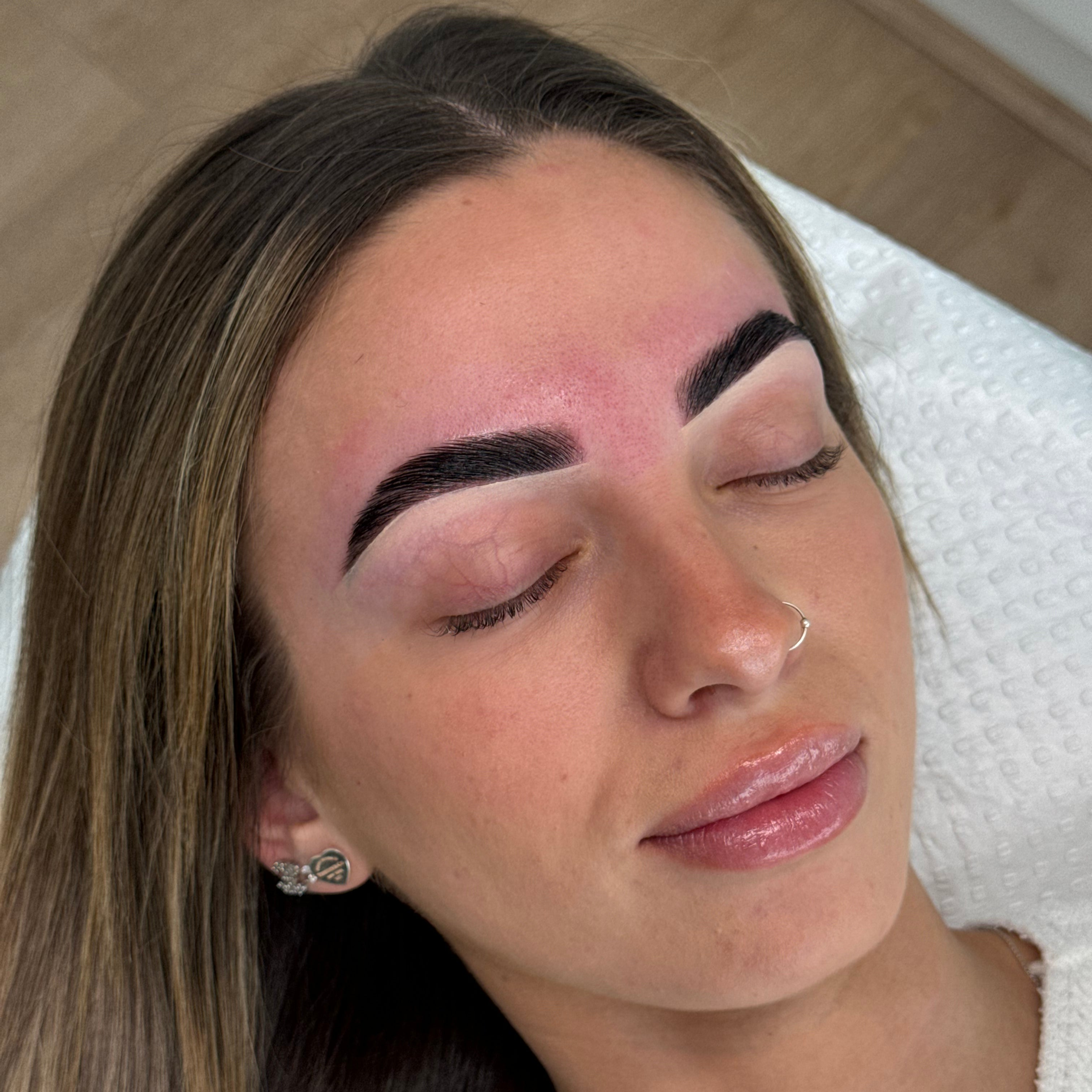 Close-up of a freshly completed brow lamination, highlighting perfectly groomed and shaped brows taught at By Tarnee Morris in Penrith during professional brow lamination training